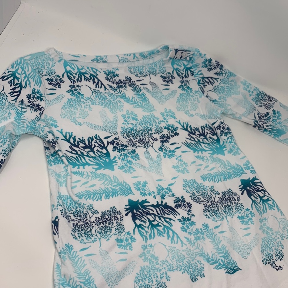 A teal and blue coral blouse from Charter Club